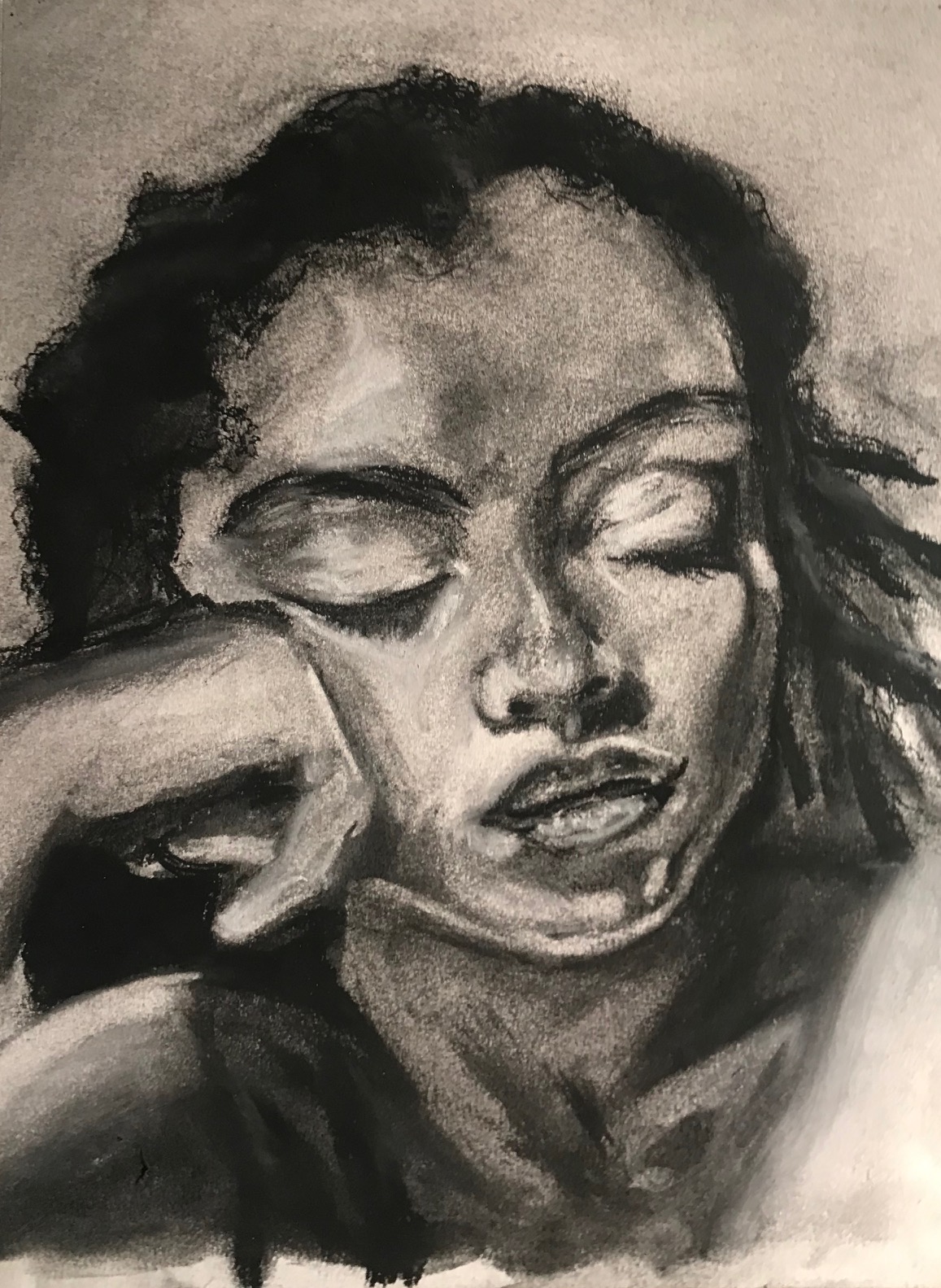 Charcoal portrait of a woman.